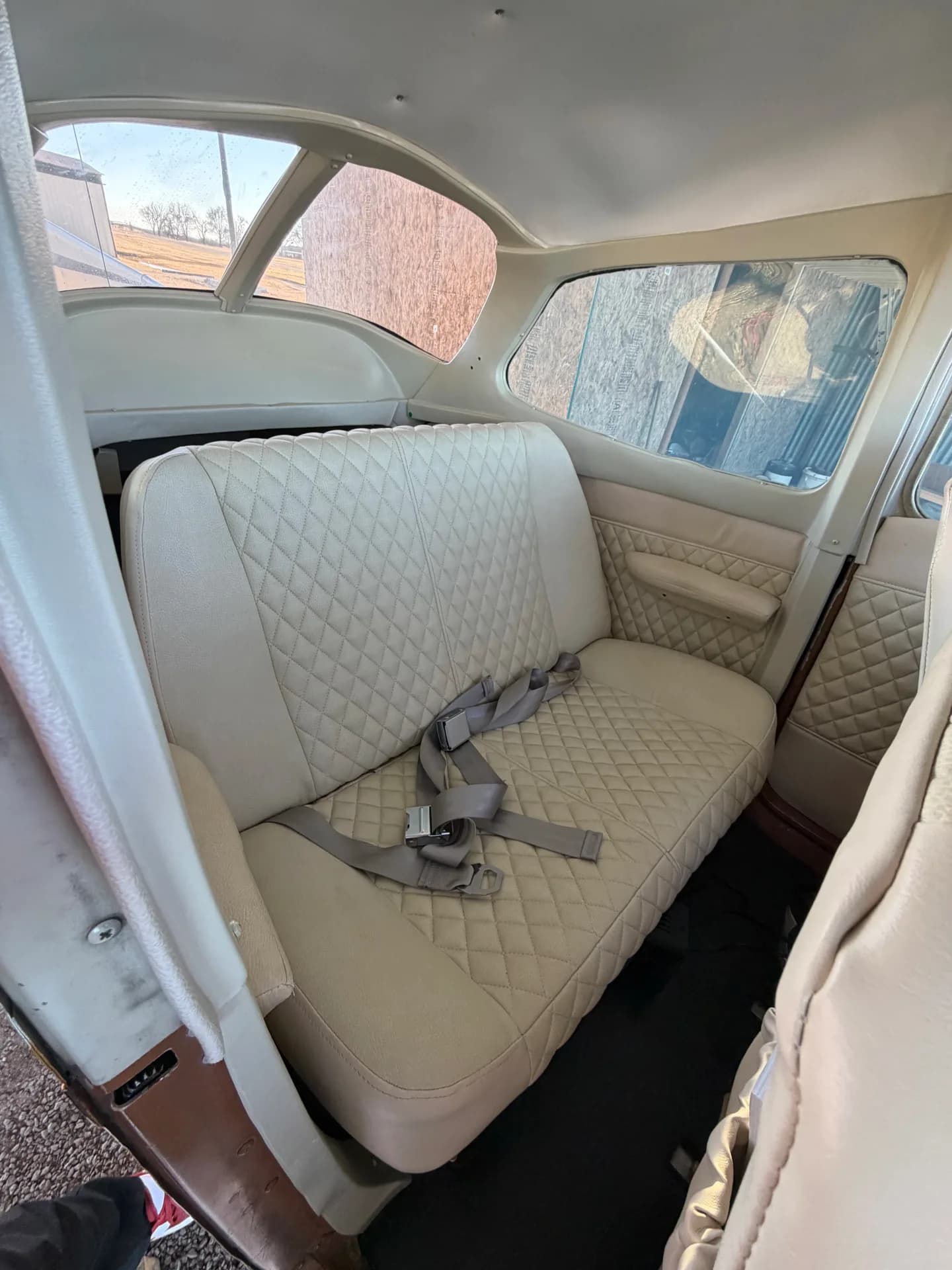 Cessna 172M rear bench seat with quilted upholstery and harnesses